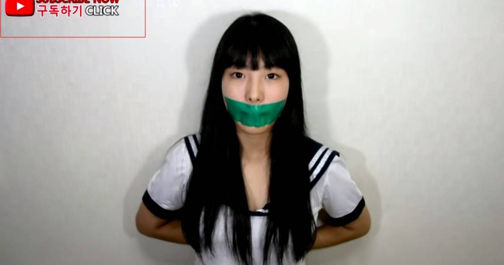 Girl Gagged In Black Duct Tape