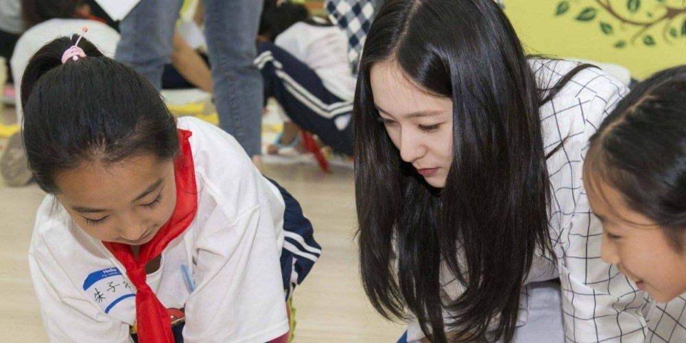 Image result for Krystal visits elementary school in China for a charity event