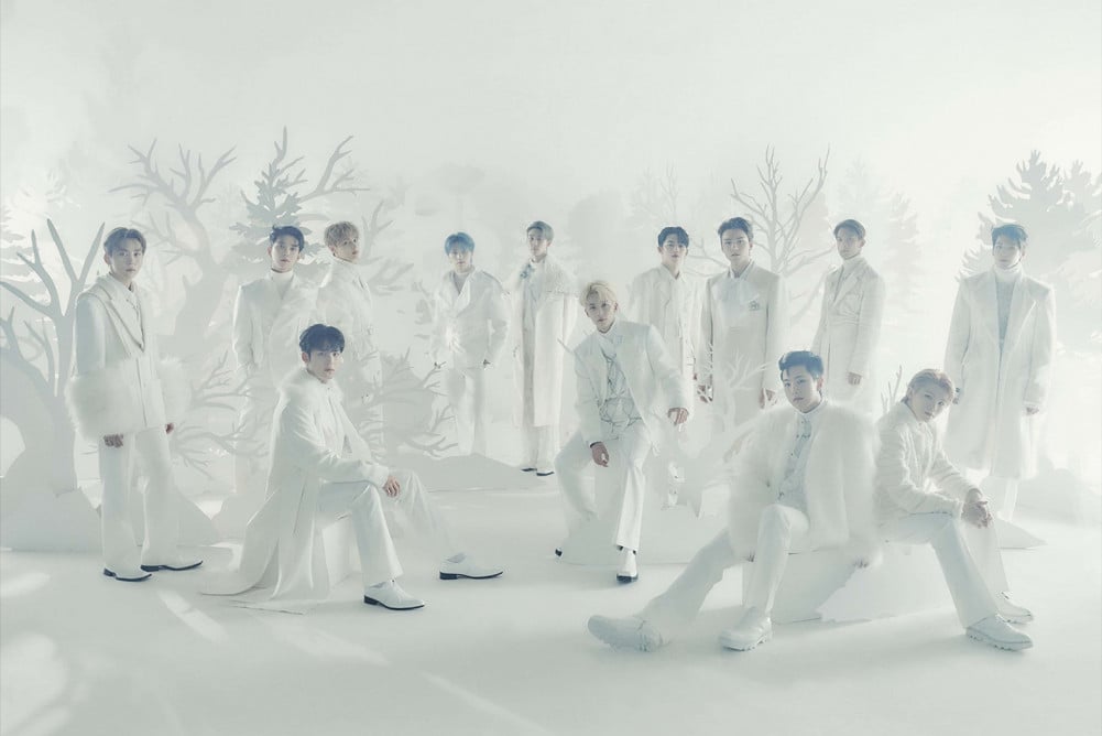 Seventeen in all white on a winter-themed set.