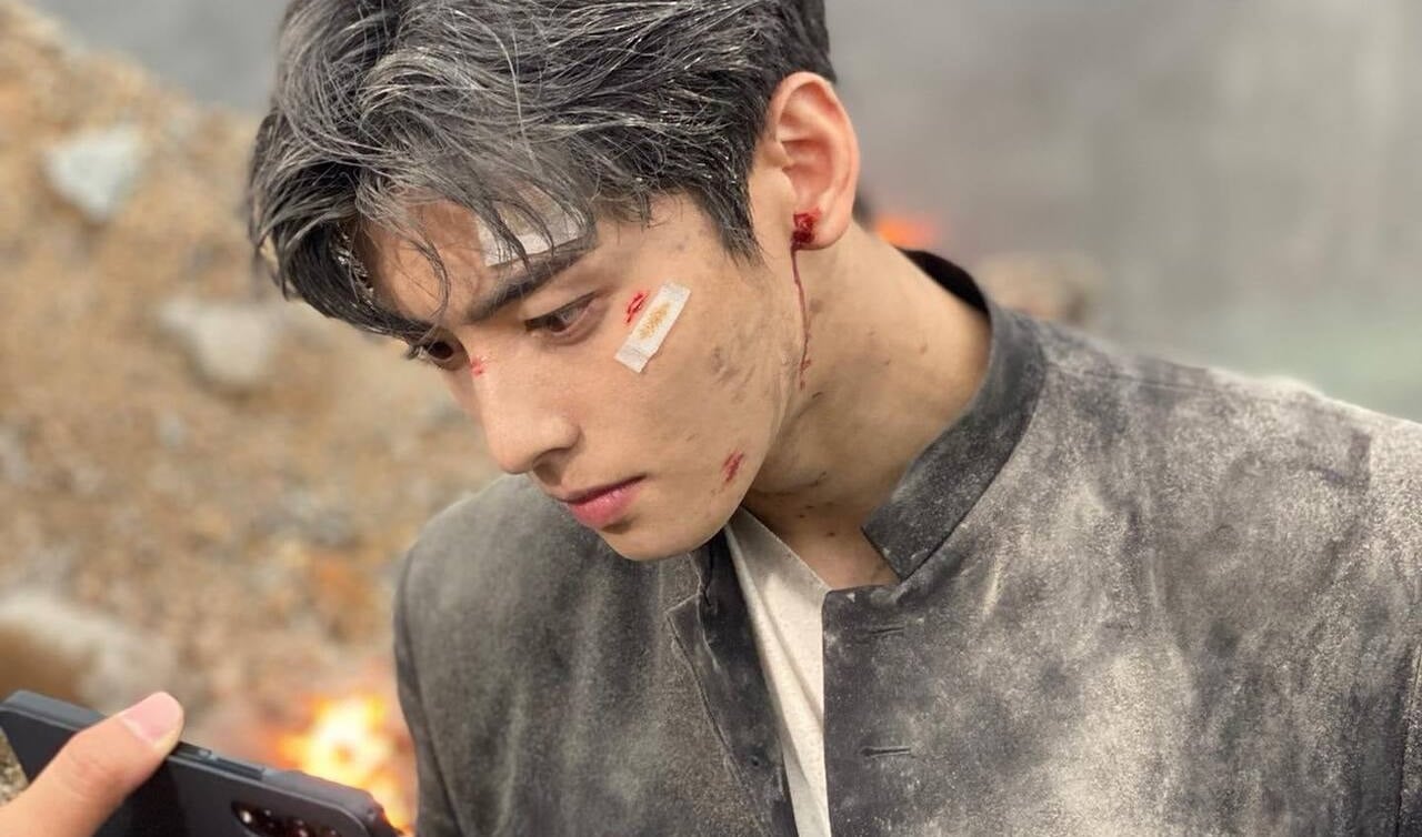 Still shot of Cha Eun Woo covered with ash on the set of 'Island' gains 